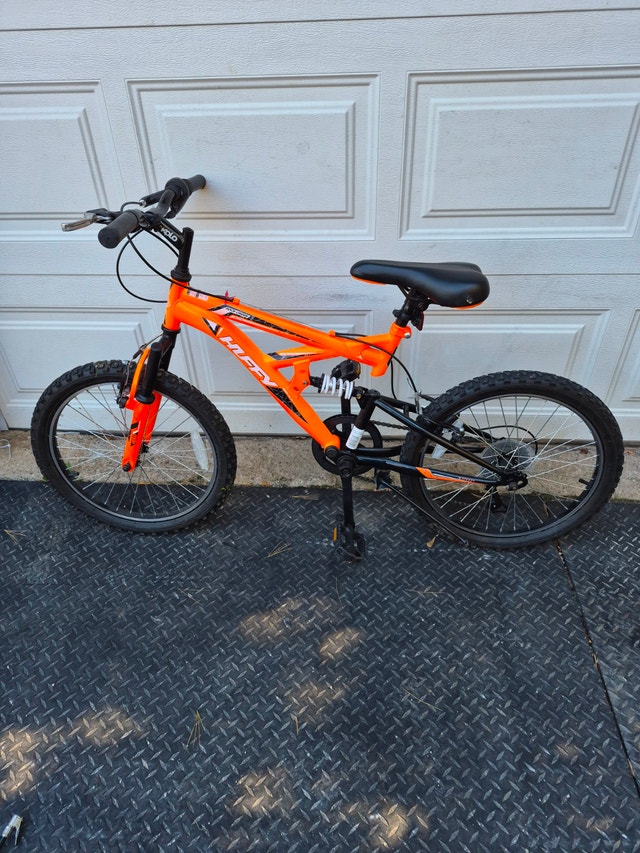 24'' wheel bike orange Huffy rock creek dual suspension