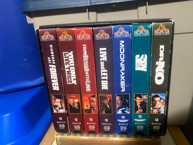James Bond VHS Collection and Assorted Books - photo 3