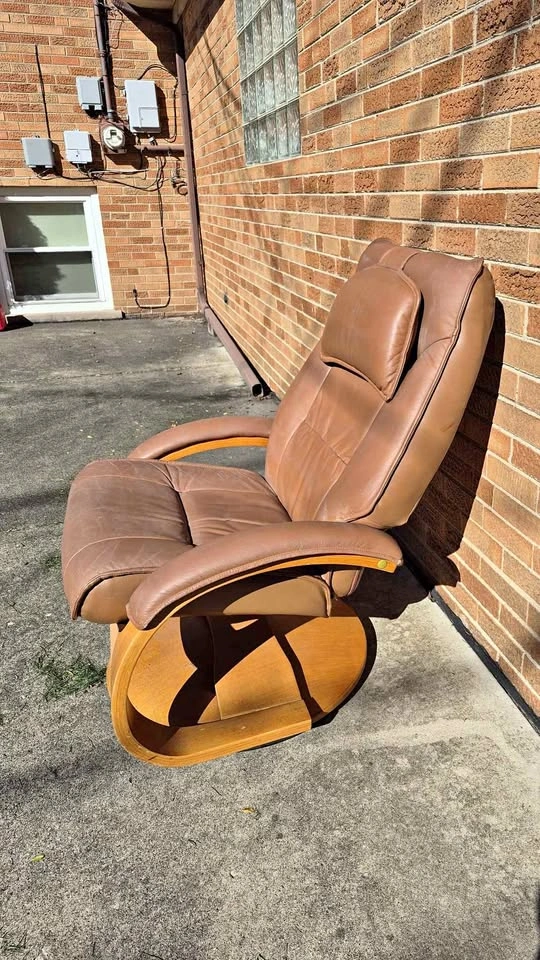 Recliner with worn faux leather