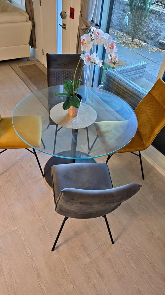 Glass Dining Table with 4 Gray and Yellow Chairs
