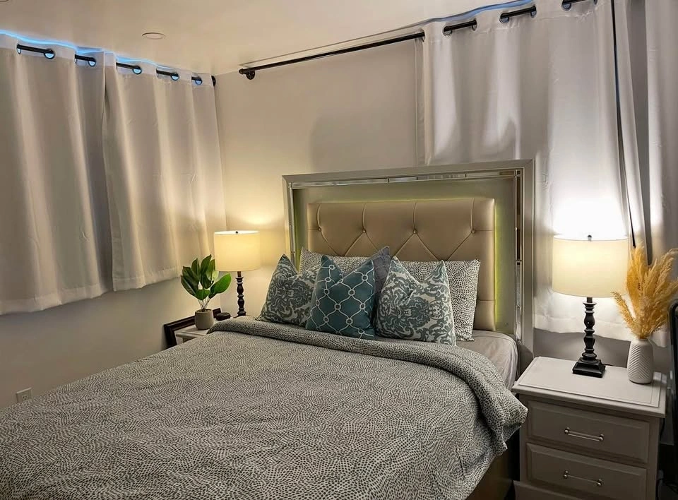 Queen bed with light and storage