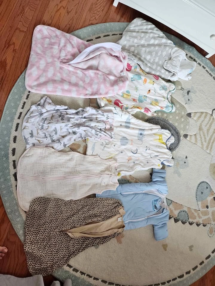Lot of baby sleeping bags and Baby Merlin's Magic Sleepsuit
