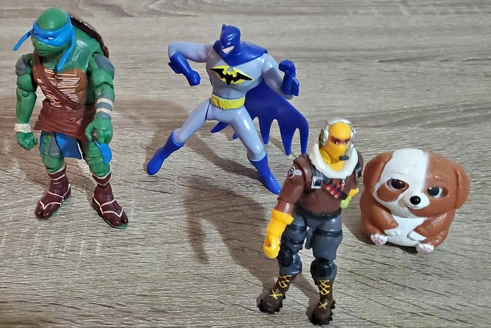 Batman, TMNT Leonardo, and Fortnite Raptor Action Figures