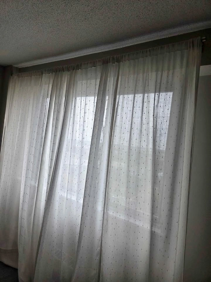 Beige long 4 curtain panels and gold metal rod
