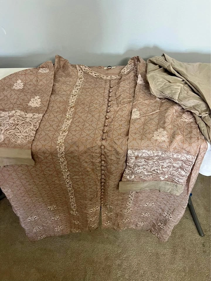 Embroidered Kurta it’s knee length with Trousers