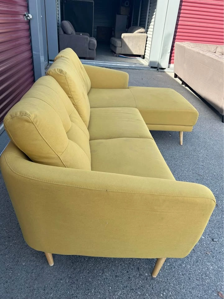 Mustard yellow Structube sectional with a chaise and wood legs
