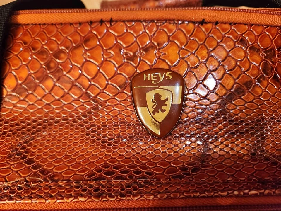 Heys Snakeskin-embossed orange travel bag
