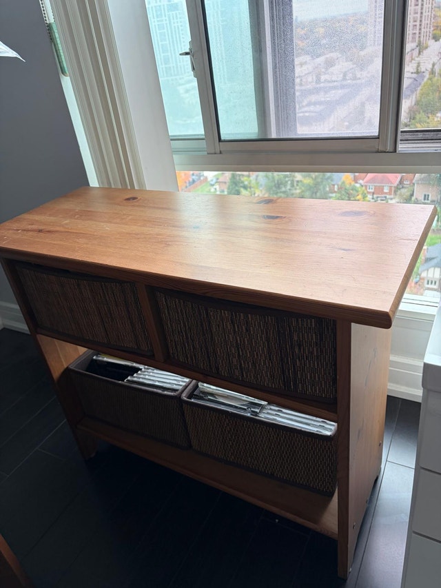 IKEA wooden storage table with storage baskets