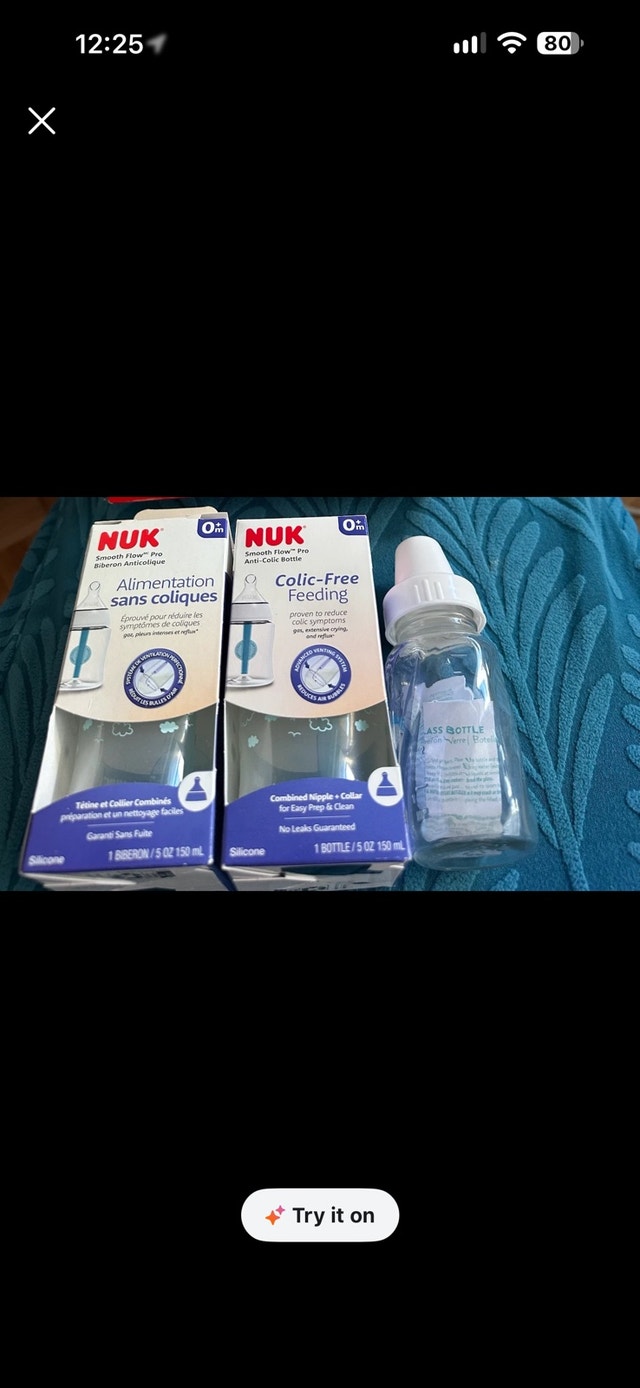 BRAND NEW feeding bottles- NUK and evenflo