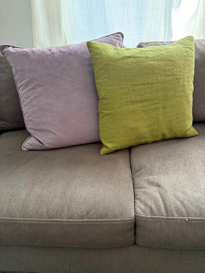 Green linen and purple velvet pillows with down-filled insert