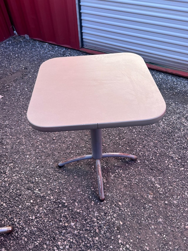 Grey pedestal tables