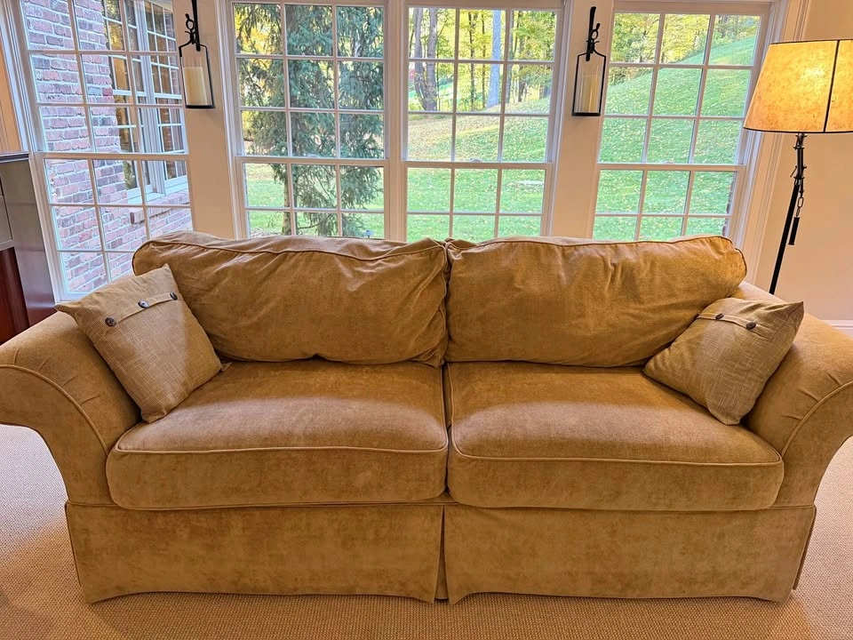 Tan Rolled Arm Skirted Sofa