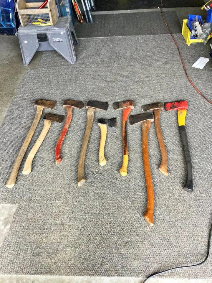 Numerous vintage axes and hatchets