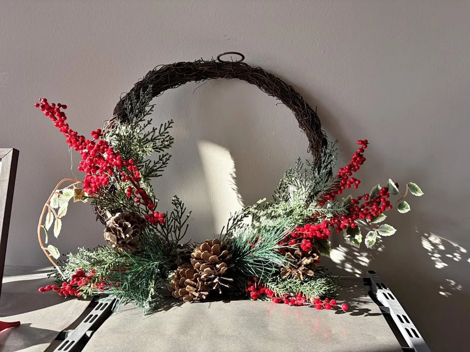 Winter Wreath with Red Berries and Pinecones