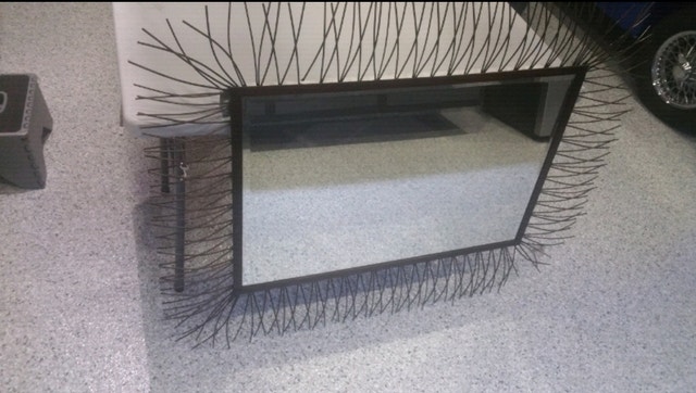 Wall mirror with beveled glass and metal frame - photo 4