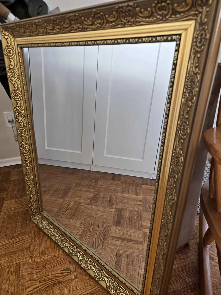 Gold-framed mirror