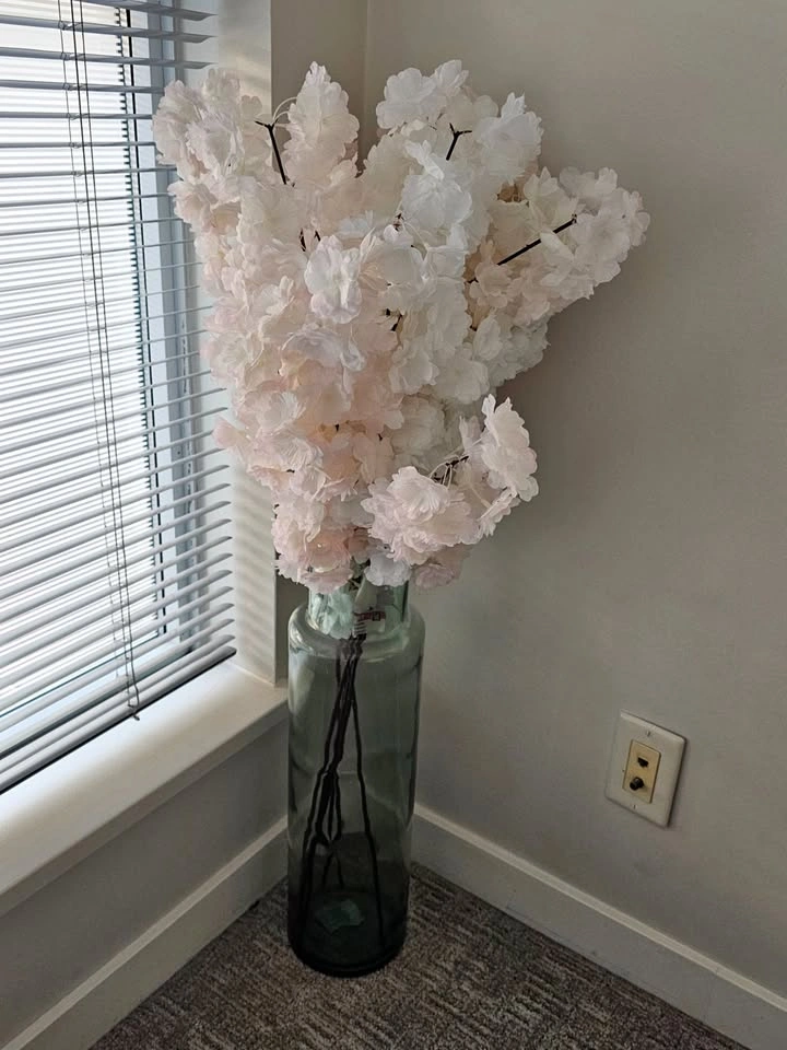 Crafted glass bottle with cherry blossoms
