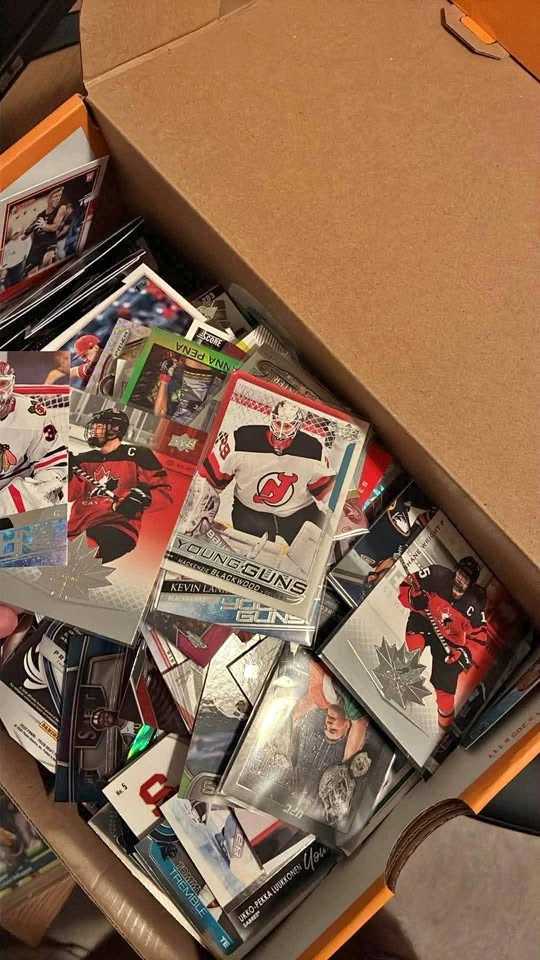 3 Boxes full of parallels and rookies all sports