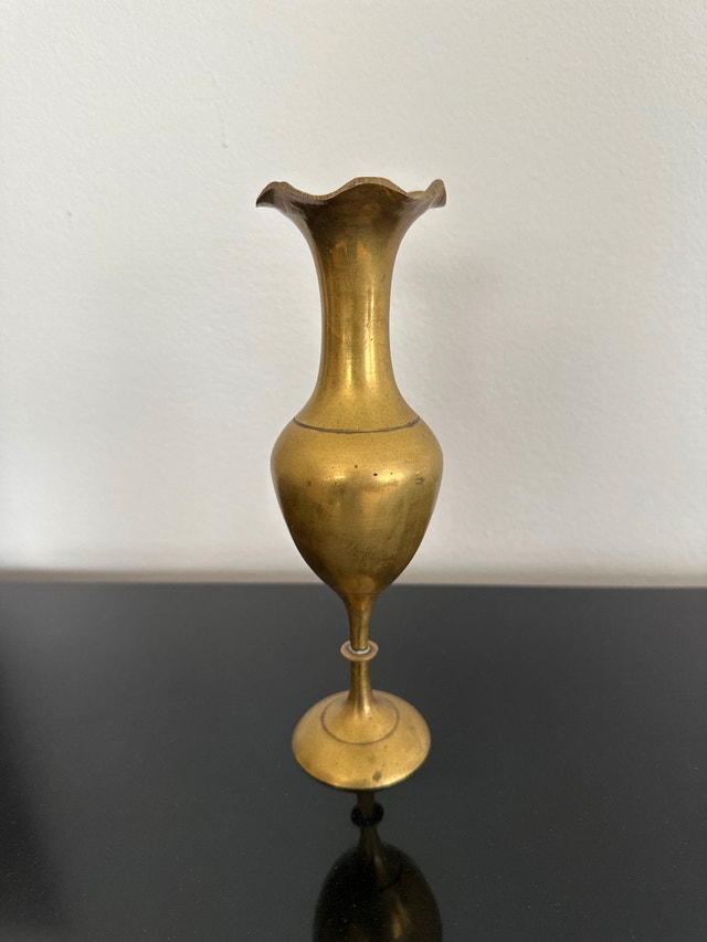 Vintage brass pedestal vase with a fluted, flower-shaped rim
