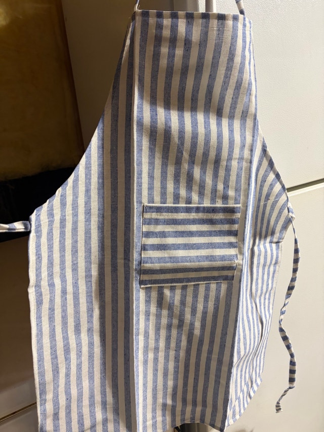 Set of four identical kitchen aprons
