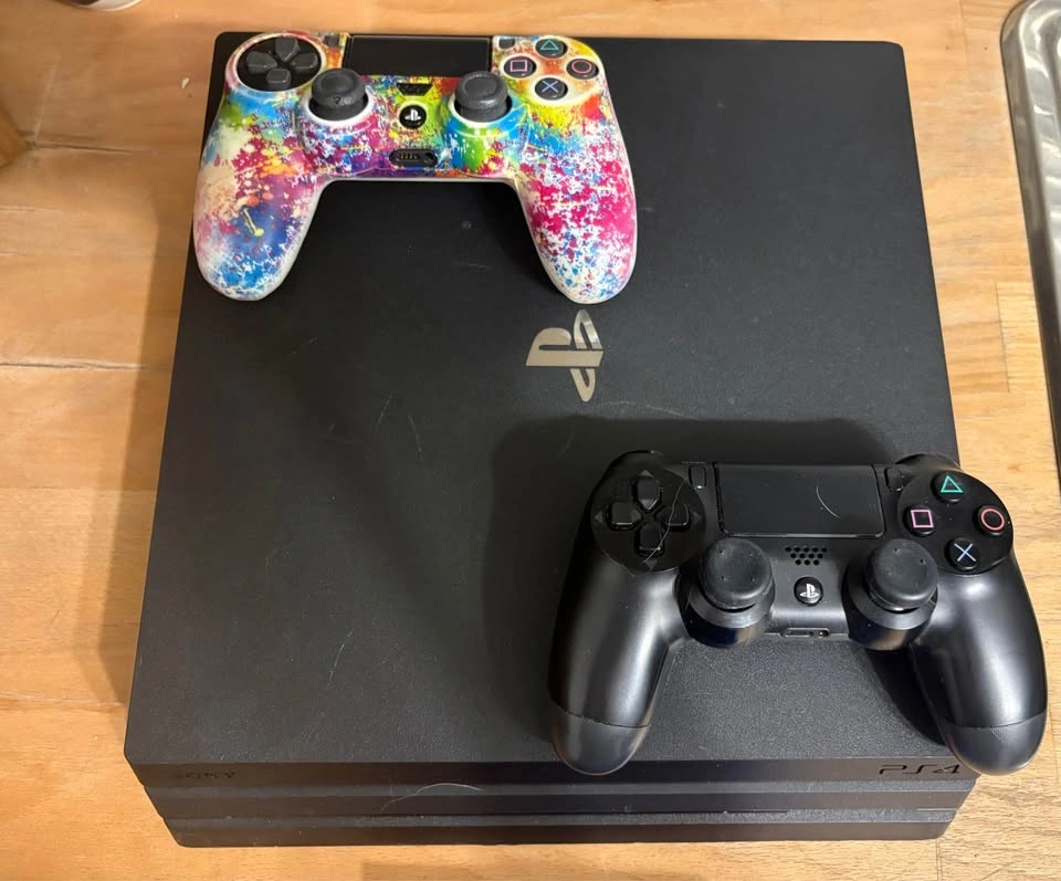 Sony PlayStation 4 Pro with 2 Controllers and 4 Games - photo 2