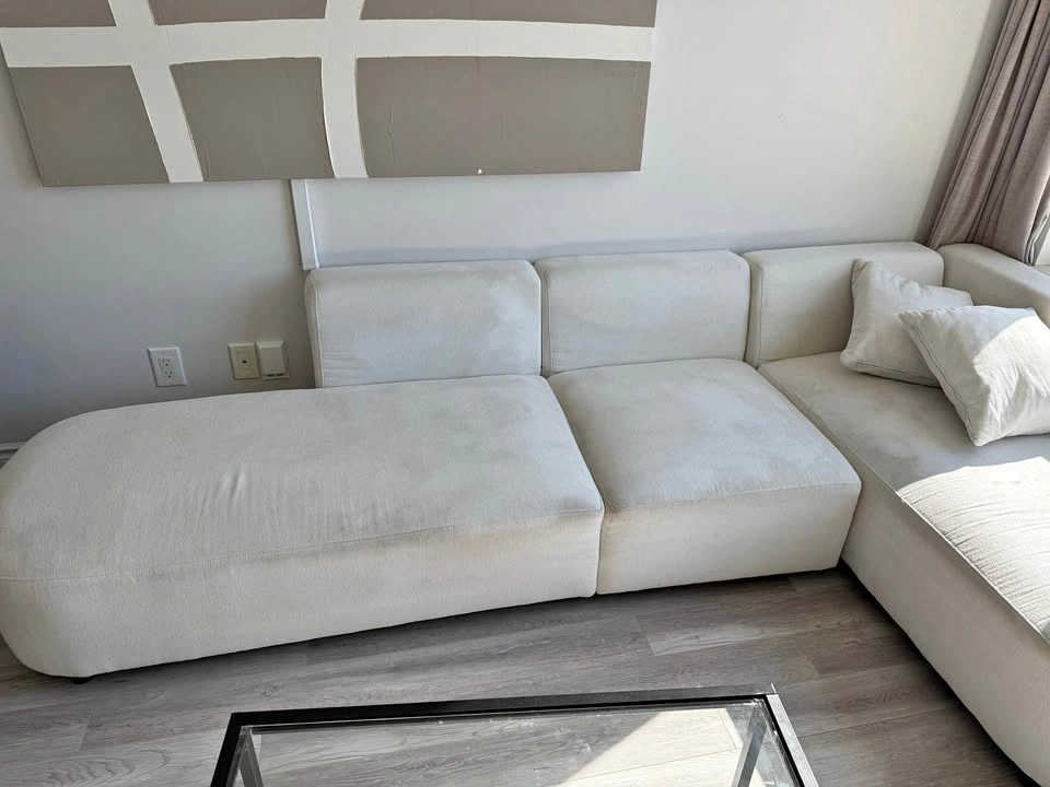White Modular Sectional Sofa with Curved Chaise