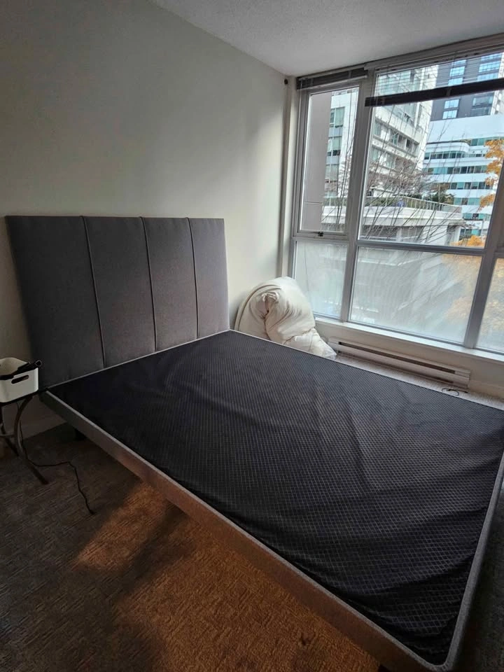 Solid bed frame with grey upholstered headboard - photo 2