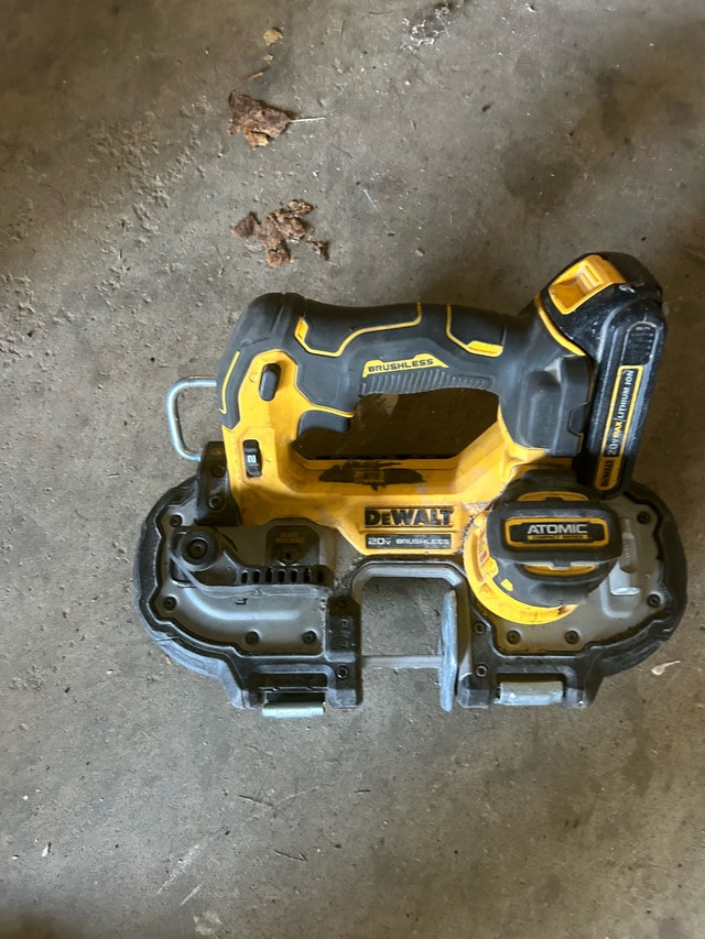 cordless Dewalt band saw with charger and battery