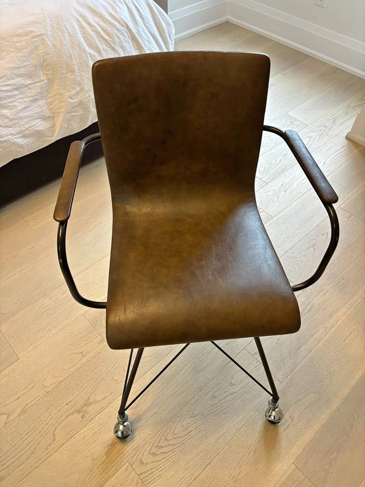 Tan office chair with arms and wheels