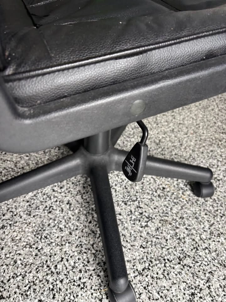 Black “leather-like” office chair on wheels - photo 3