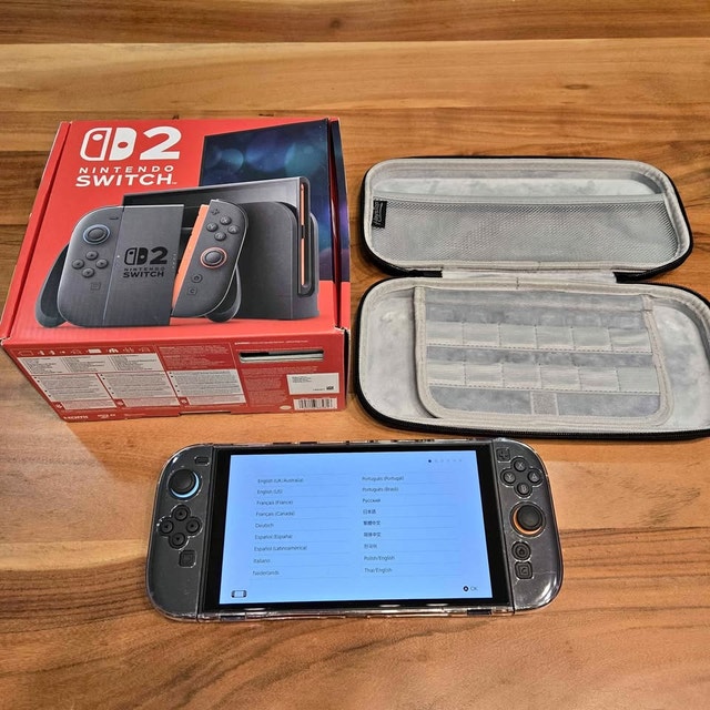 Nintendo Switch 2 like new in box with extras