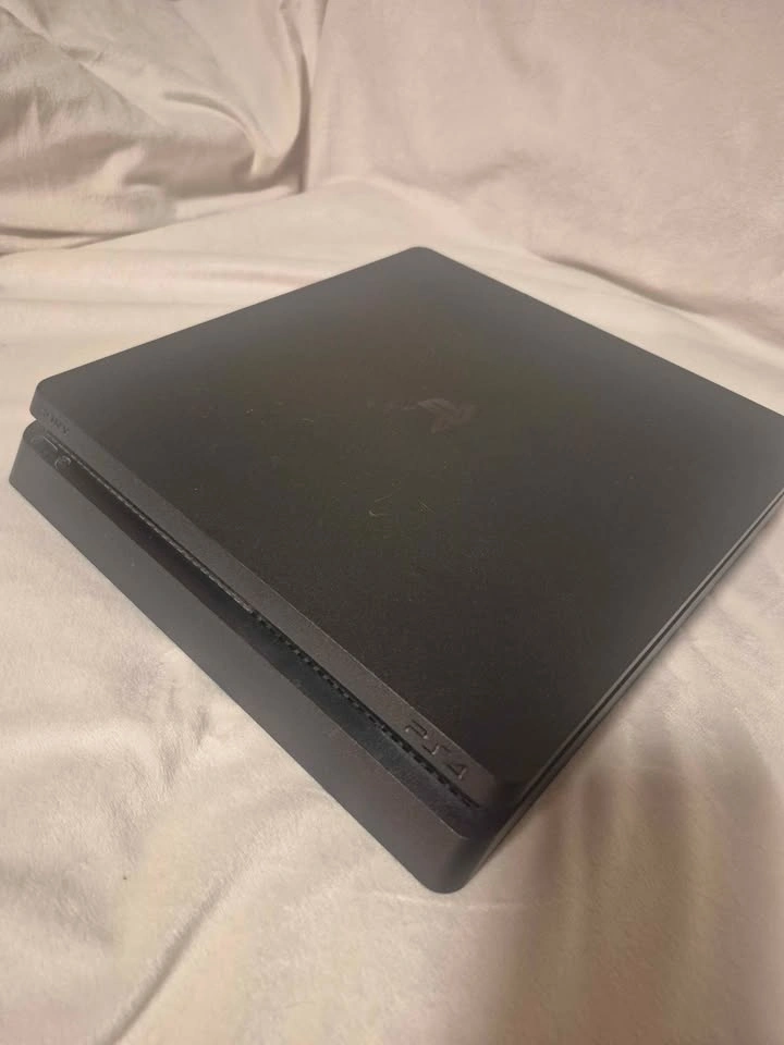 Sony PlayStation 4 (PS4) Slim – 1TB – 2 Controllers + FREE Game - photo 2