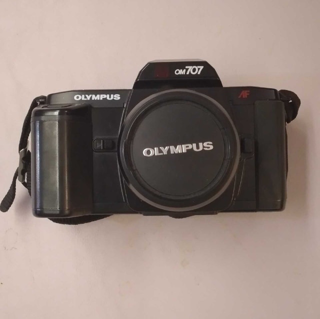 Olympus OM-707 35mm SLR Camera with Sakar 17M Flash