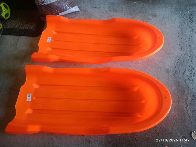 Orange Plastic Toboggan Sleds
