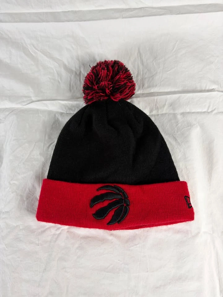 Toronto Raptors New Era Pom Toque – Black/Red NBA Beanie
