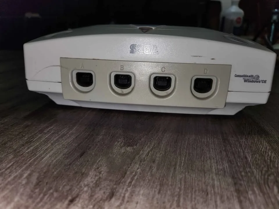 Sega Dreamcast console only. Power must be held down image indicator(2)