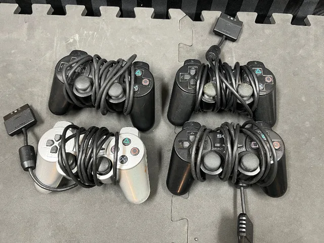 Four (4) PlayStation 2 (PS2) Controllers FOR PARTS thumbnail