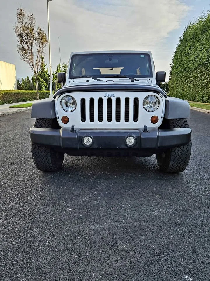 2011 Jeep Wrangler Unlimited · Sport thumbnail