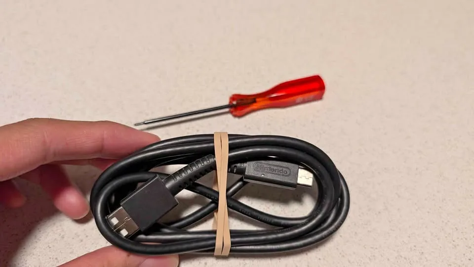 Nintendo switch USB C charging cable & screw driver thumbnail