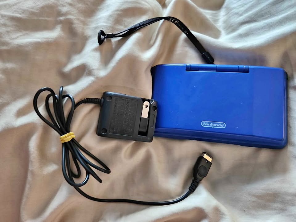 Original cobalt blue Nintendo DS with charger