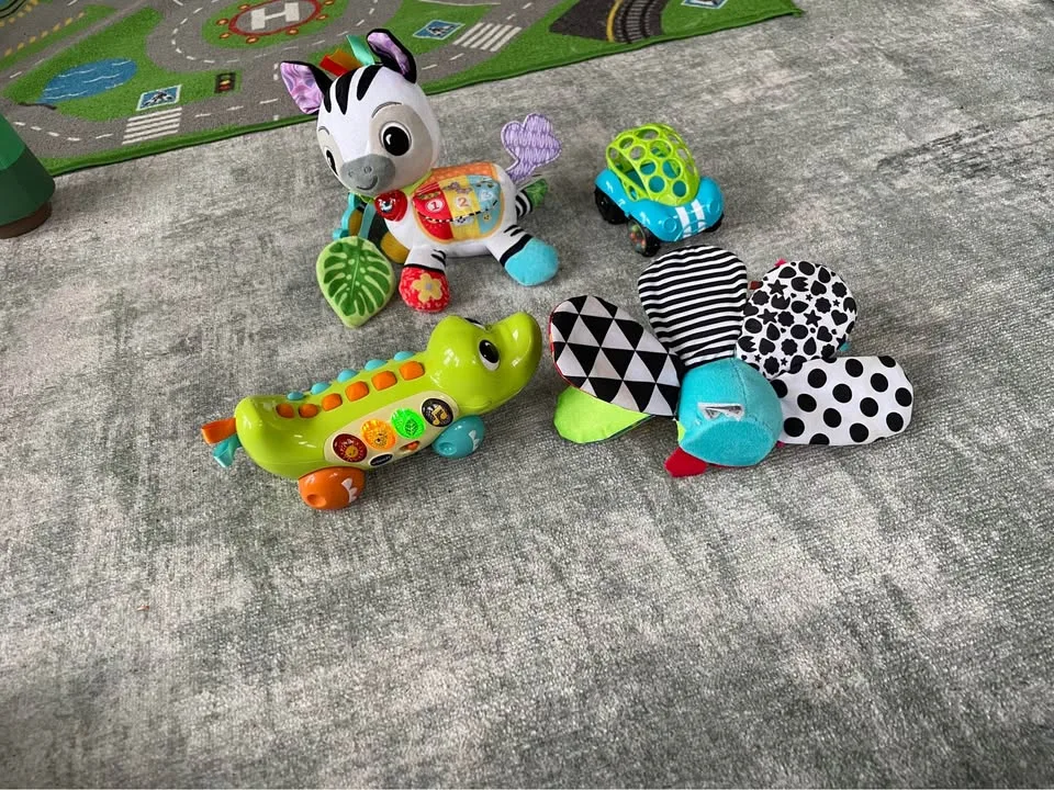 Vtech Zebra, Lamaze Peacock, Vtech Crocodile & Toy Car image indicator(2)