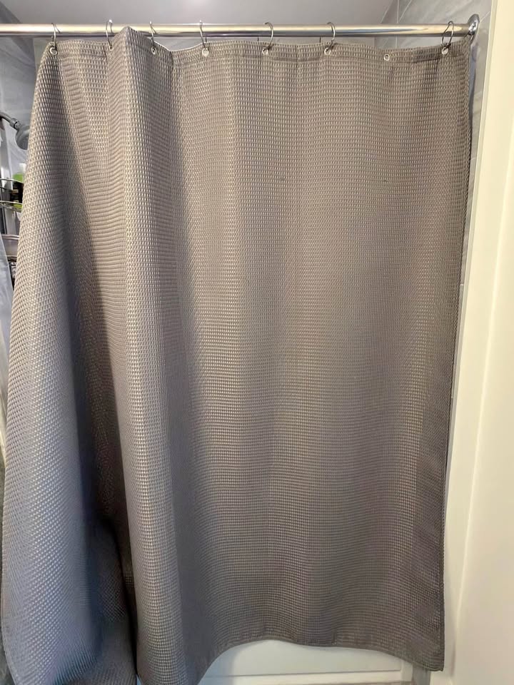 Fabric shower curtain with hooks