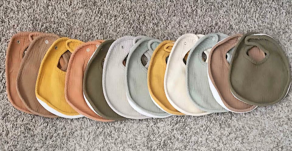 12 pack of Muslin and Fleece Baby bibs
