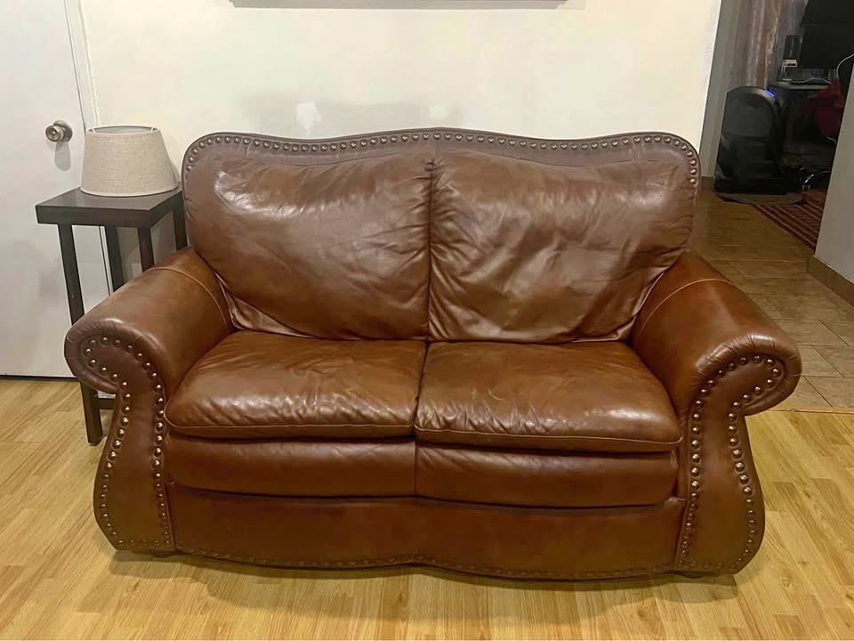 Italian leather couches + coffee table + side table