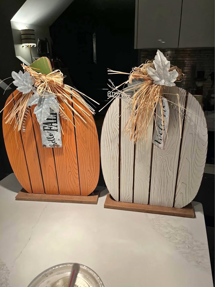 Two rustic pumpkins with metal adornment