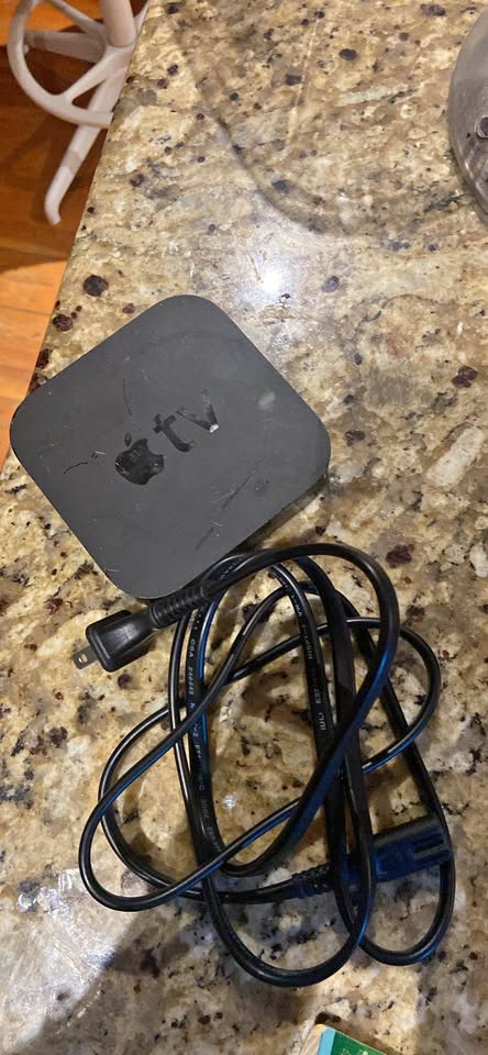 Apple TV with cord and remote