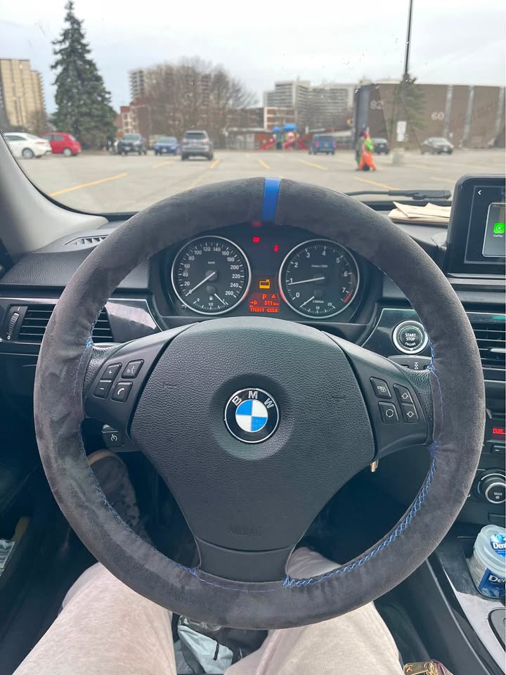 Alcantara steering wheel wrap hand stitching