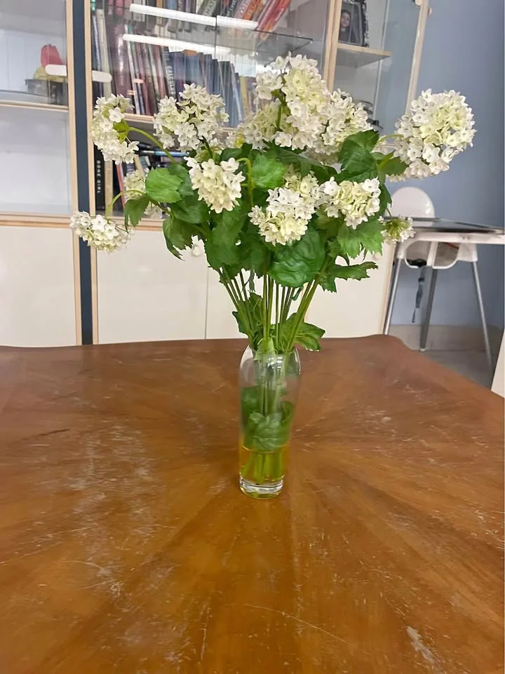 Glass vase with faux flowers thumbnail