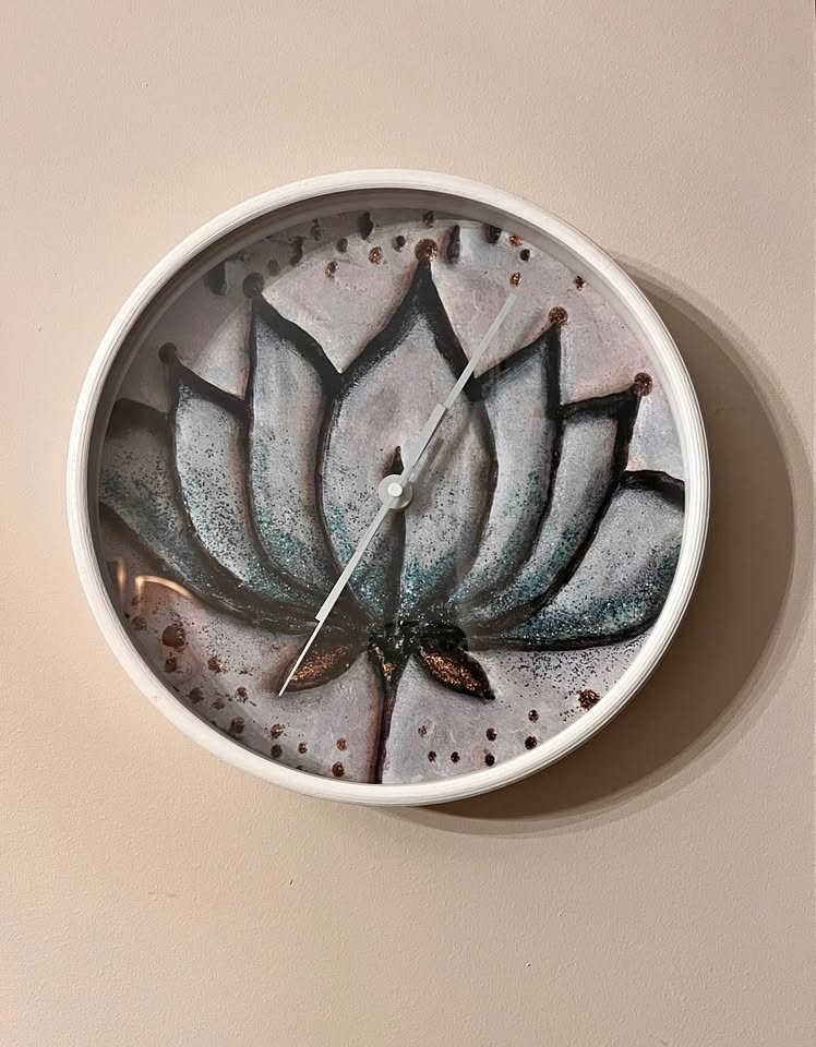 Moving sell lotus wall clock
