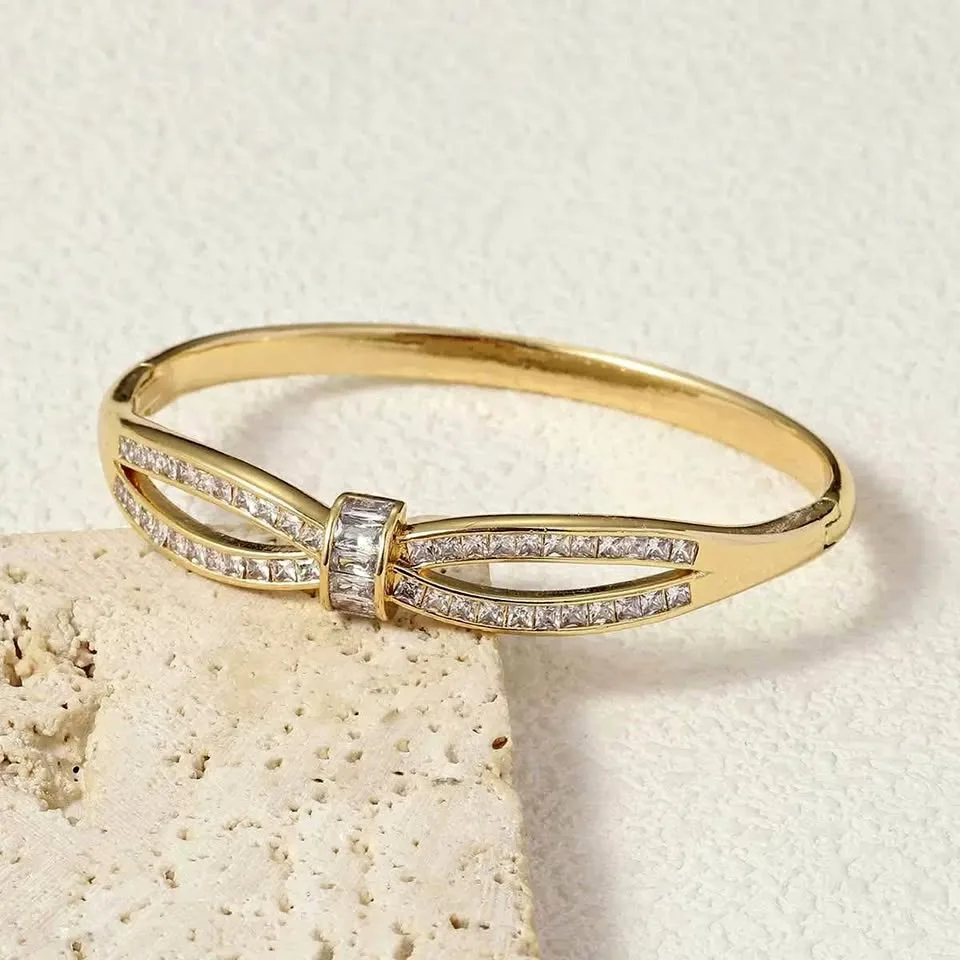 Gold toned cubic zirconia knot bracelet thumbnail
